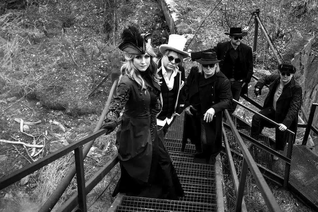 A black and white photo of a group of people on stairs captures the release of pain.