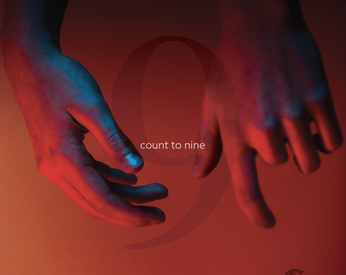 Two hands, awash in a blend of blue and red lighting, rise against a backdrop embossed with the number 9 and "Count To Nine." In the bottom right corner, "Cathedral in Flames" heralds an electrifying release.